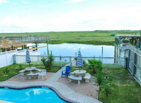 Pool with Canal views Minutes 2 beach BBQ Pit